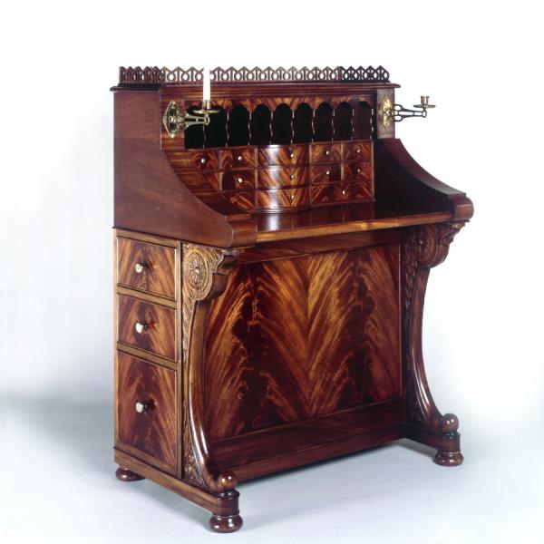 Davenport   An interpretation of the nineteenth century davenport style that includes hand carving, crotch mahogany veneer work, a slide-out desk, six drawers and a secret compartment.