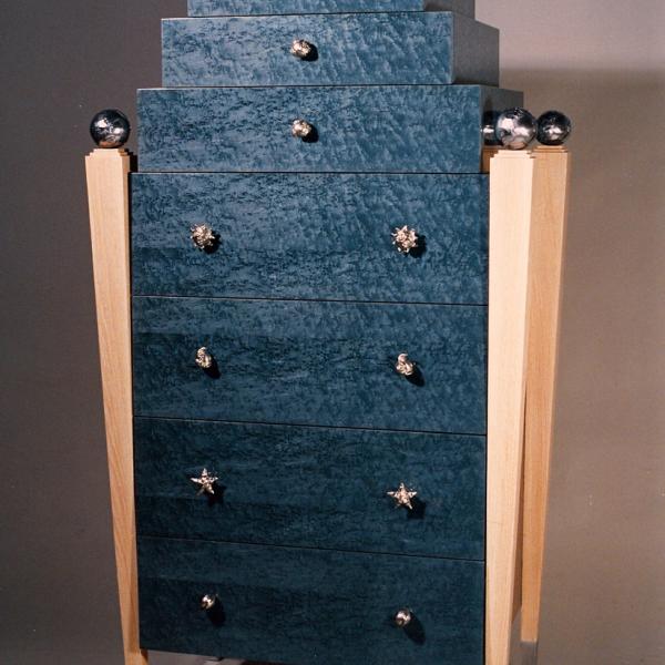 The Blue Dresser. This dresser in a post-modern style features blue-dyed birdseye maple veneer 